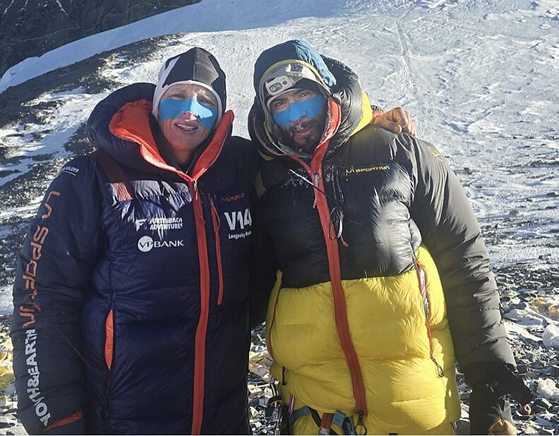 two guys in down suits and face masks