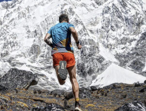 Tyler Andrews training in the Khumbu during a previous expedition, Lhotse south face in background.