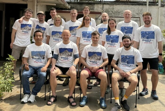 An expedition team poses on a roof terrace in Kathmandu. 