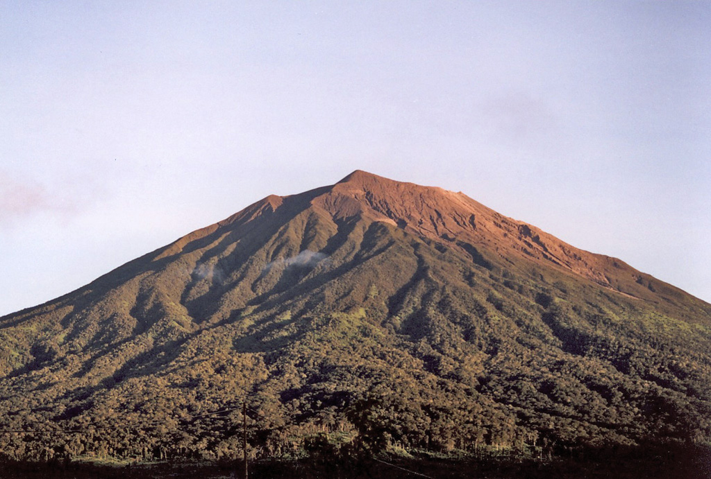 A tall peak rising above a valley