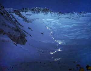 A line of lights from Sherpas' headlamps in the night on Everest and Lhotse.