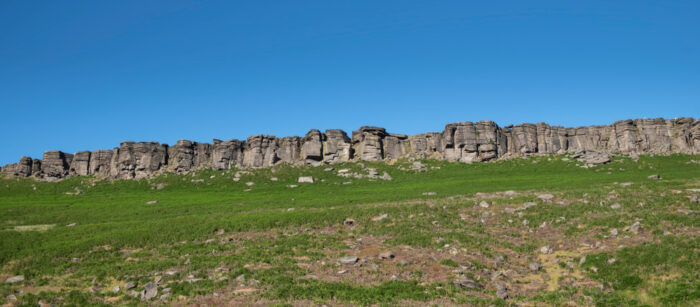 A panorama shot of Stanage Edge, a gritstone edge in Peak District national park, Derbyshire