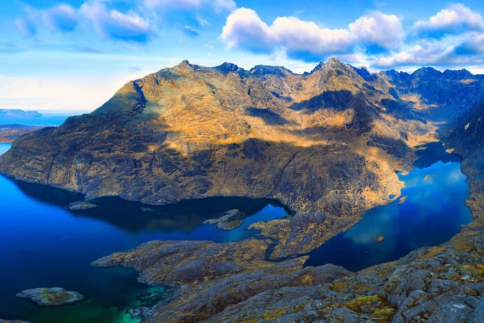 View from Sgurr Na Stri over Loch Coruisk to the rugged peaks of the Black Cuillin Hills, Isle Of Skye, Scotland