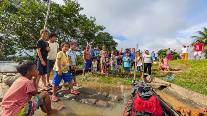 Local communities surround the Kayak of French adventurer Noe Perchet