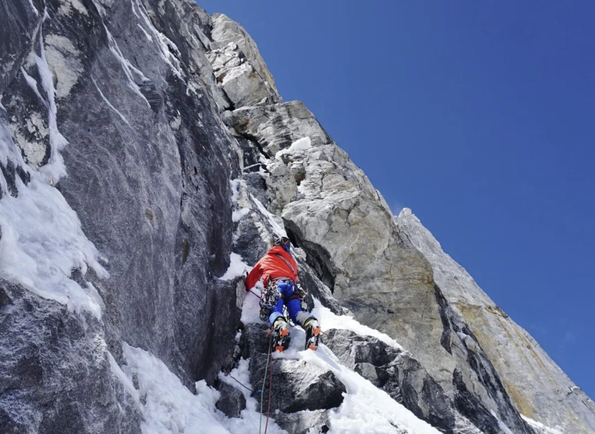 A climber on a mixed wall.