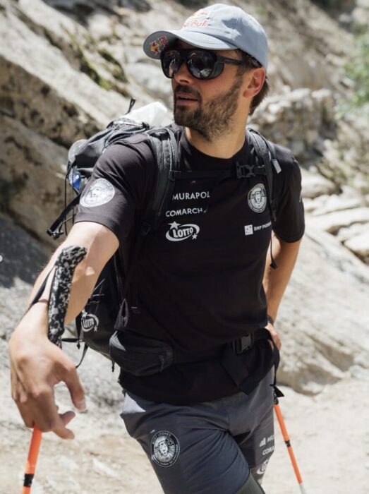 Close shot of Andrzej bargiel in a black t-shirt, sunglasses and cap.