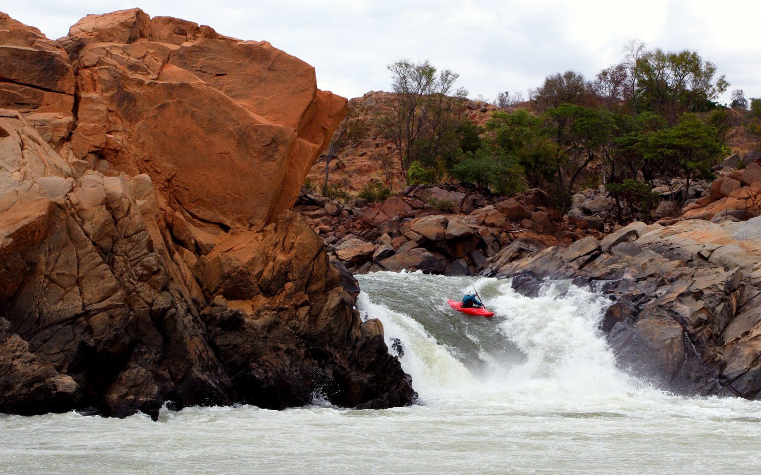 Kayaking over a waterfall
