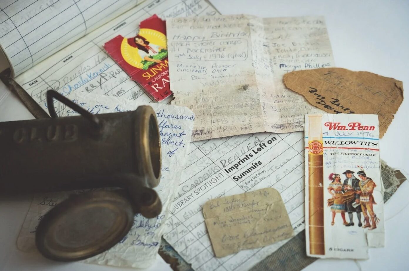 A collection of items and summit registers from the mountains in Colorado