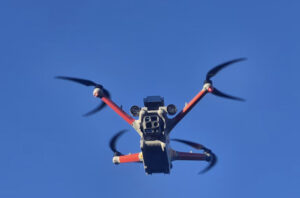 drone in air against blue sky