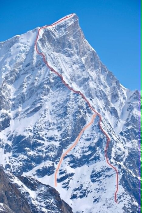 A line on a peak's ridge marking a new route. 