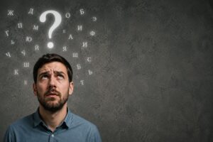 a puzzled-looking guy with a big question mark floating over his head and with Cyrillic letters floating around the question mark and his head.