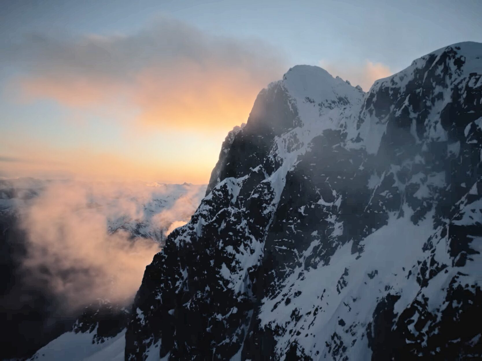 A snowy ridge at sunrise