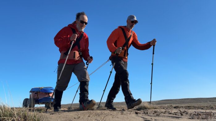 Canadian adventures John Dunn and Paul Van Peenen pulling their sleds on custom portable wheels