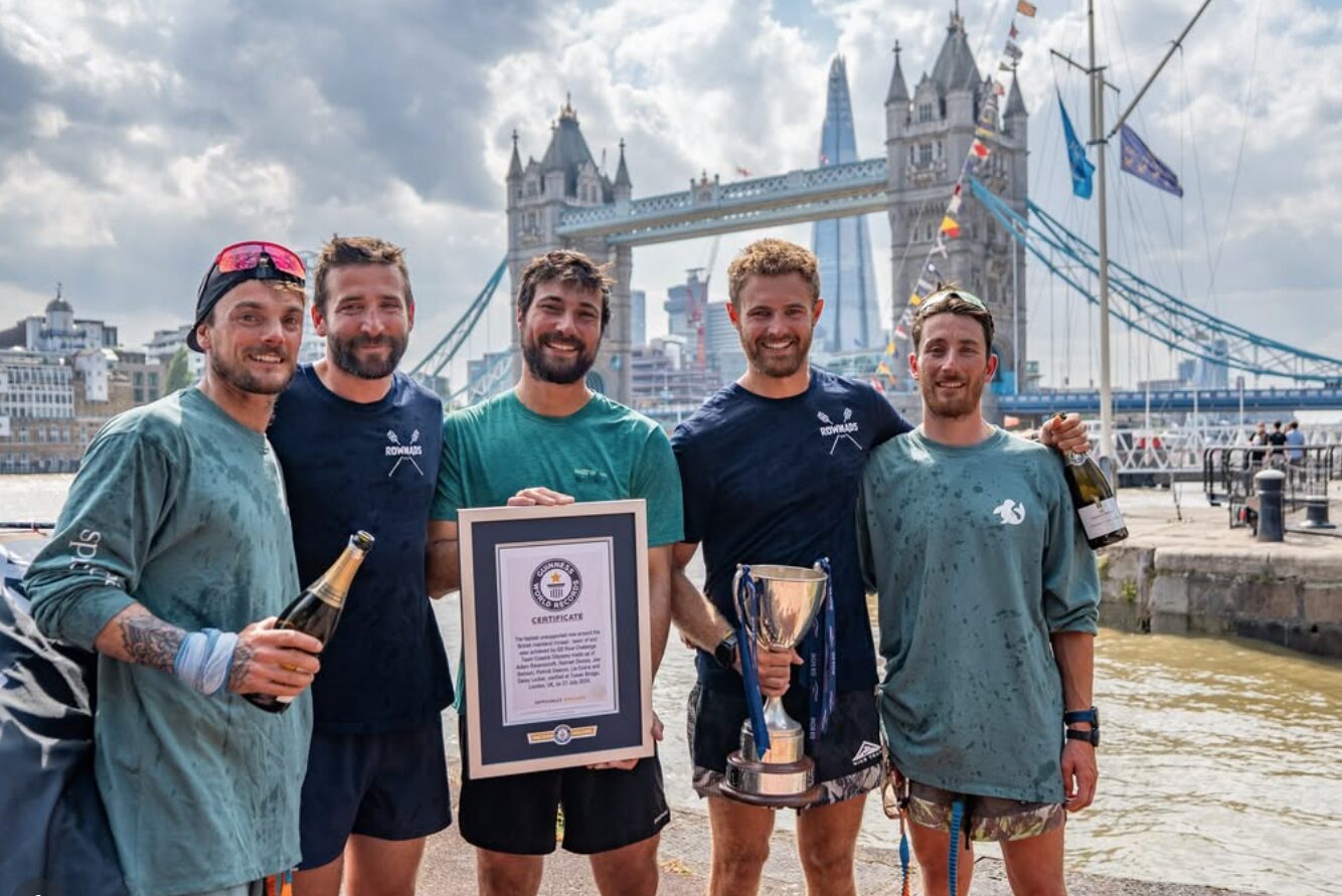 Rowmads are the first five person crew to row around mainland Britain. They stand at the finish line with their World Record certificate