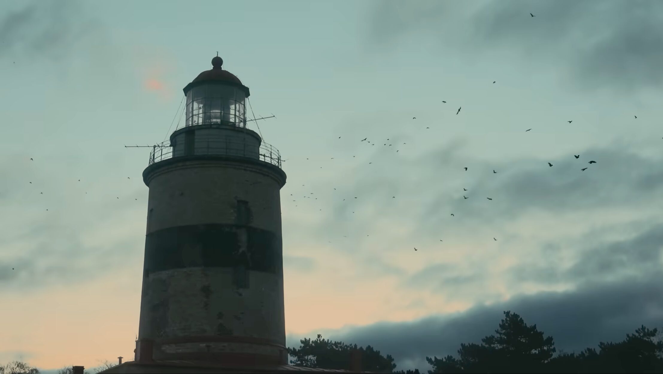 Early dawn behind a lighthouse
