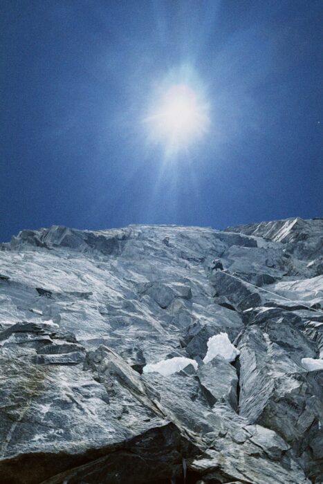 A face of rock and ice under the sun.