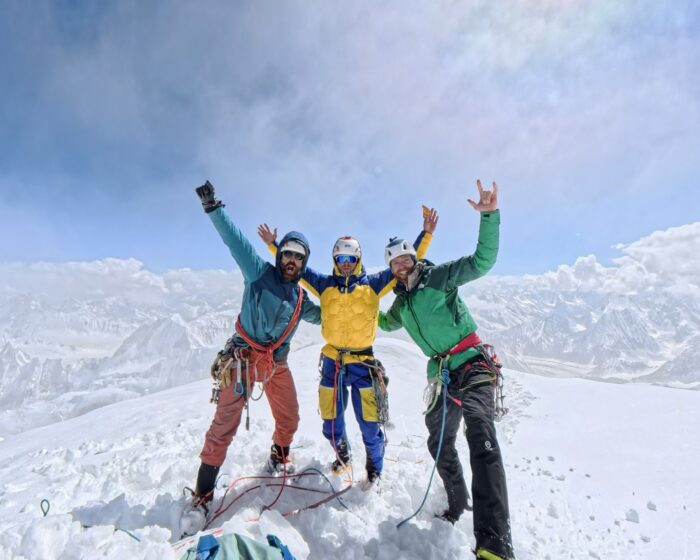 The climbers on the flat, snowy summit of Tahu Rutum.