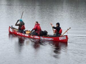 Will Vyse, Georges Kirijian, and Nolan Aziz in a canoe.