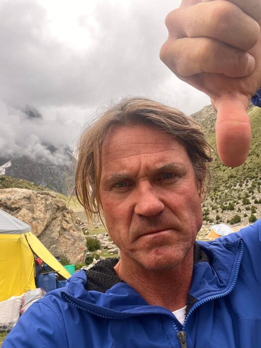 Close shot of Marek holecek looking angry and pointing down with his thumb. 