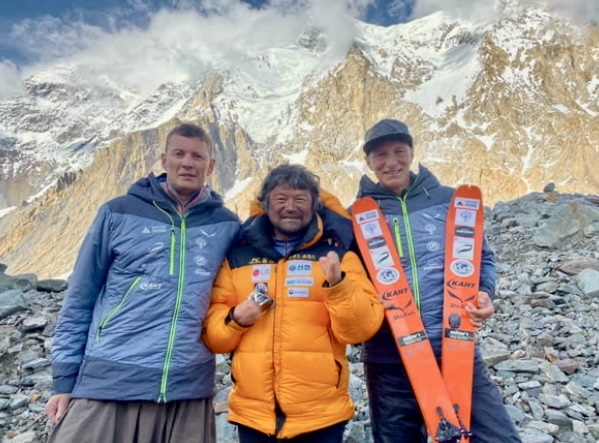 From left to right: Anton Pugovkin, Kim Hong-bin, and Vitaly Lazo at Base Camp. 