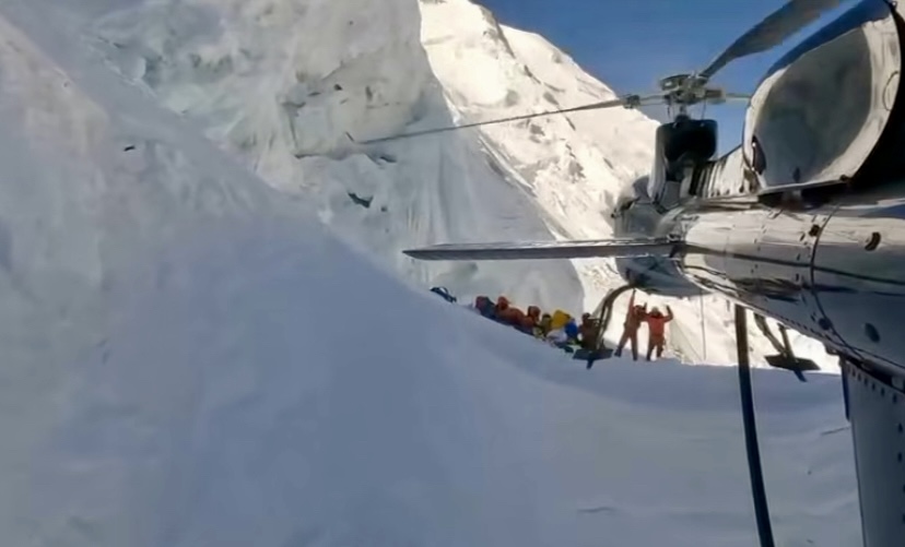 Simone Moro flying toward Camp 3 on Annapurna I with his helicopter for a rescue, in 2025. 