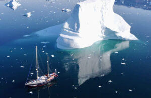 sailboat near iceberg