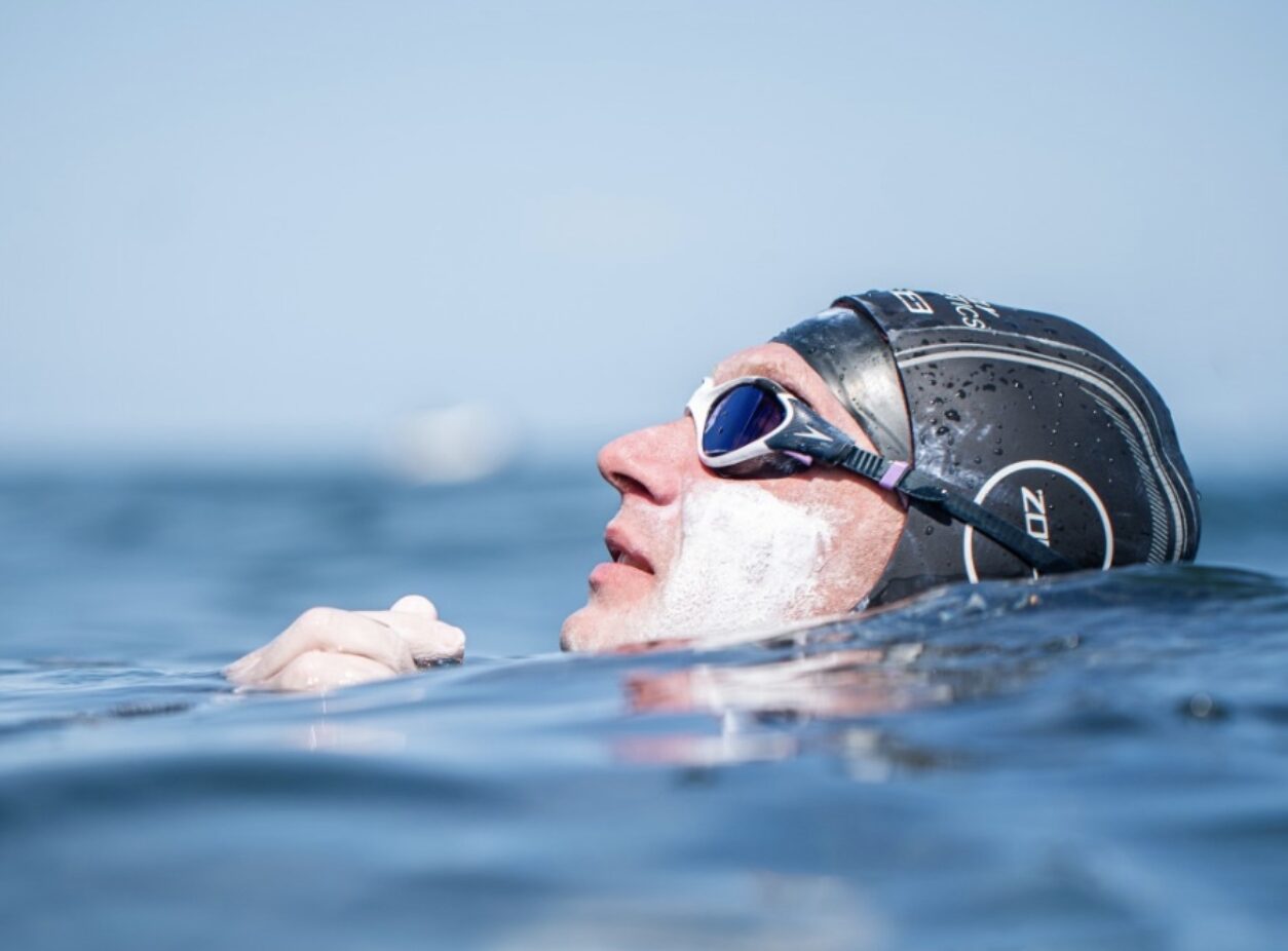 swimmer on his back, head only