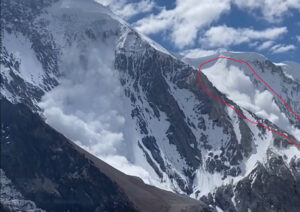 An avalanche sweeps a face of Broad Peak.