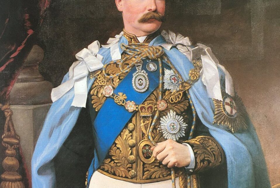 A portrait of a man wearing official, jewel-encrusted insignia