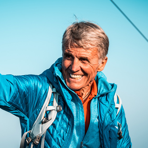 Close shot of Peter Habeler smiling. 