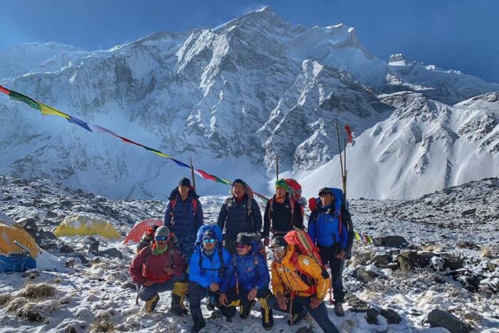 Nepalese climbers in front of Annapurna. 