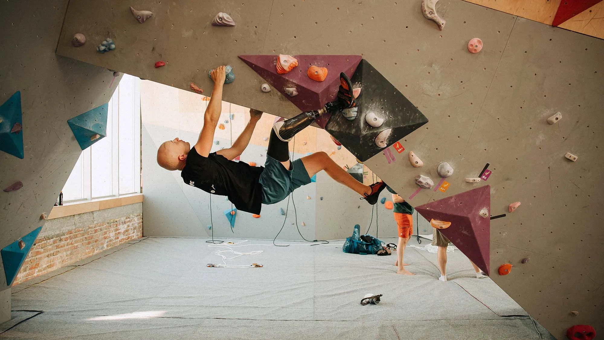 A climber on an indoor wall