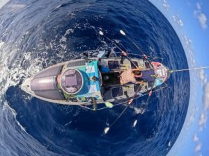 An aerial shot of the Monkey Fist crew as they row