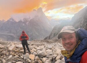 Climbers at a magical mountain setting at sunset.