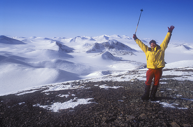 happy expeditioner with hands in air