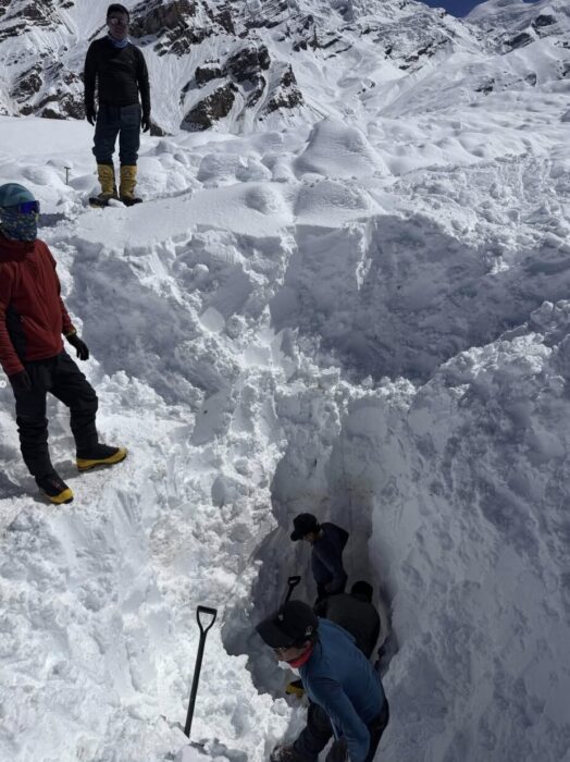 rescuers digging in 3 meters of snow.