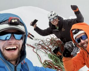 Raymond Eckland, Jon Zerain, and Josue Sanchez on the summit of Chacraraju West.