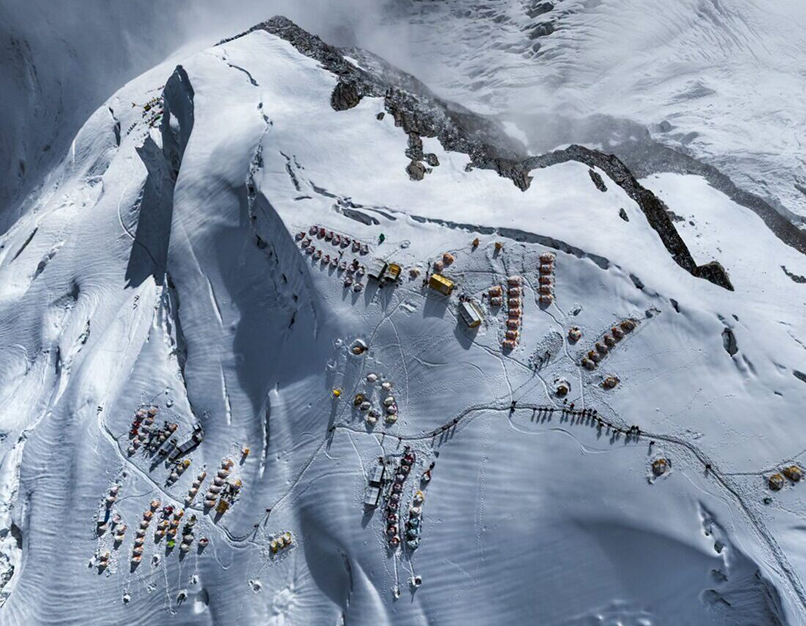 view of himalayan mountain camp on snow from the air