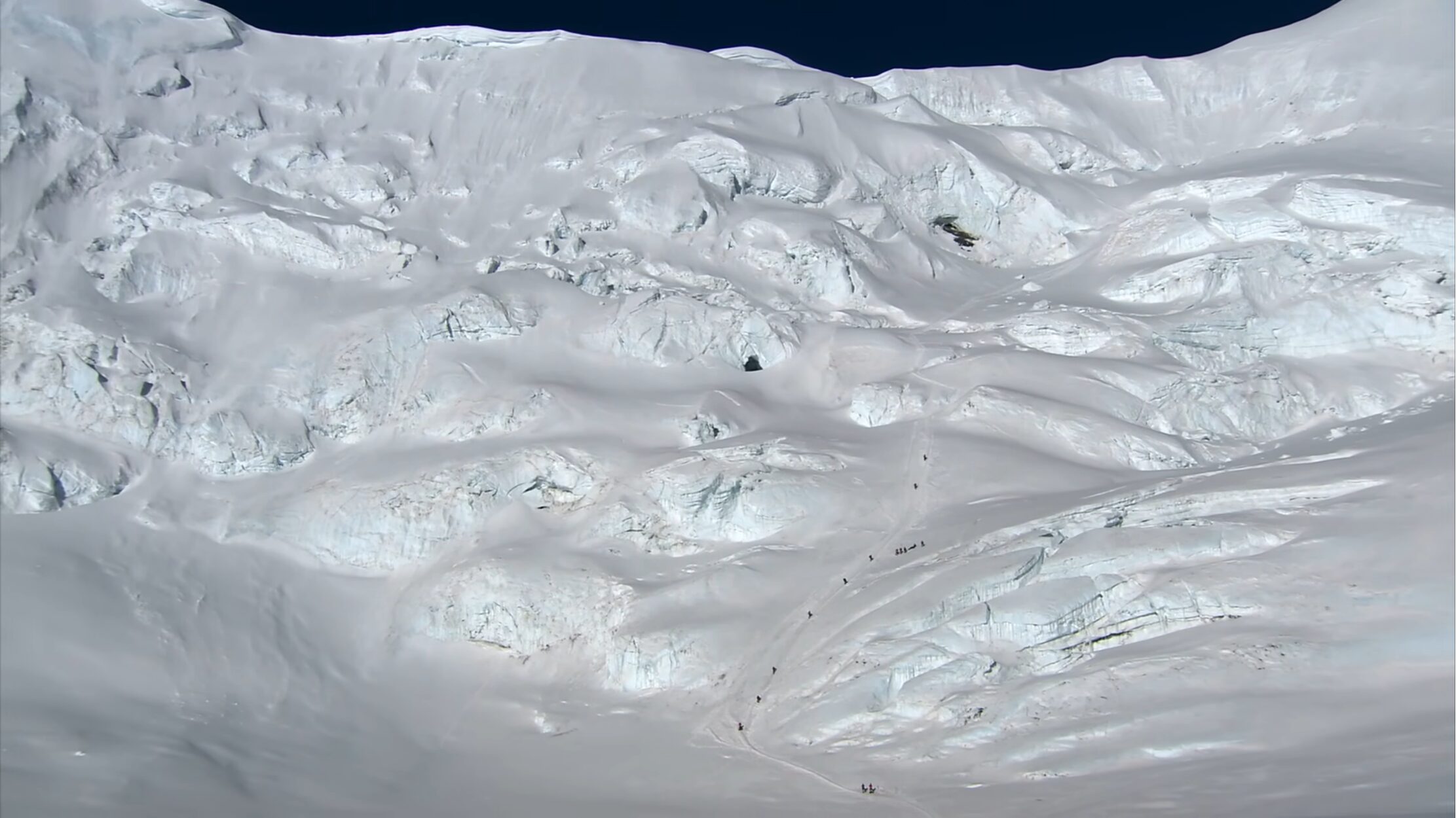 men climbing Everest, from above