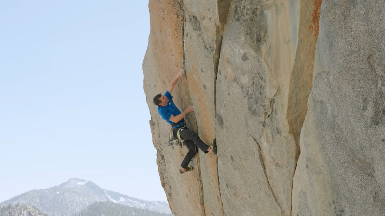 A man free climbing a rock face