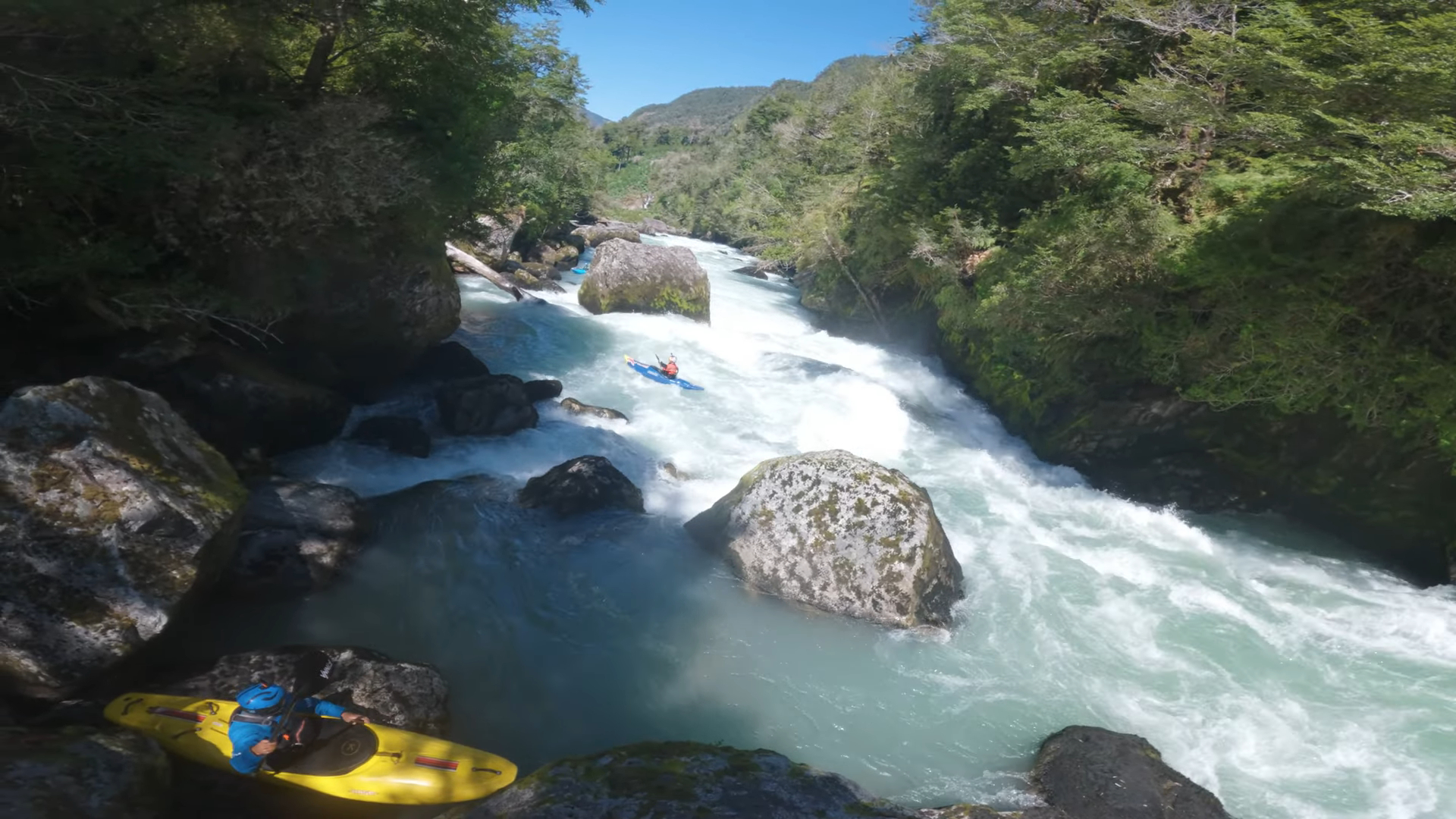 A man whitewater kayaking