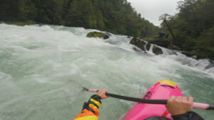 kayaker's perspective down whitewater river