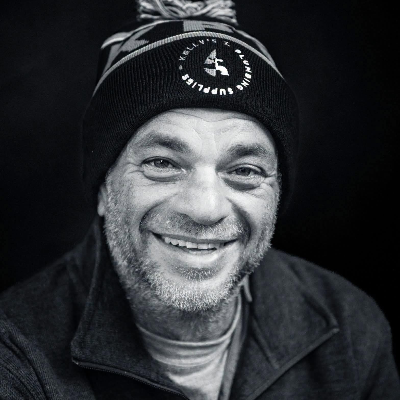 A black and white close up portrait of One Step Max