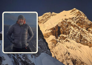 ama dablam with inset of climber