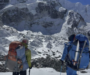 two climbers look toward Everest-Lhotse massif