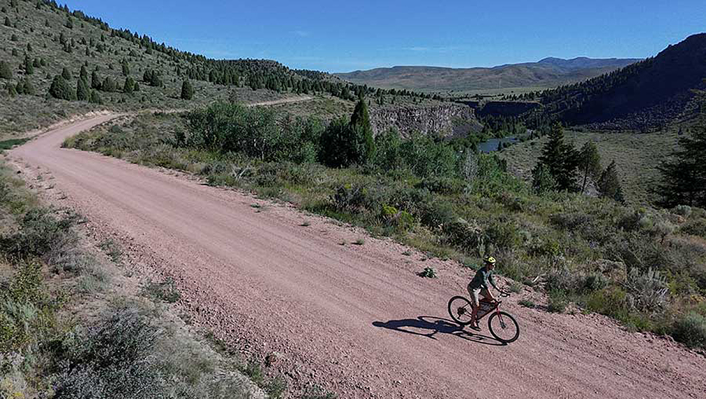 cyclist on backcountry gravel road
