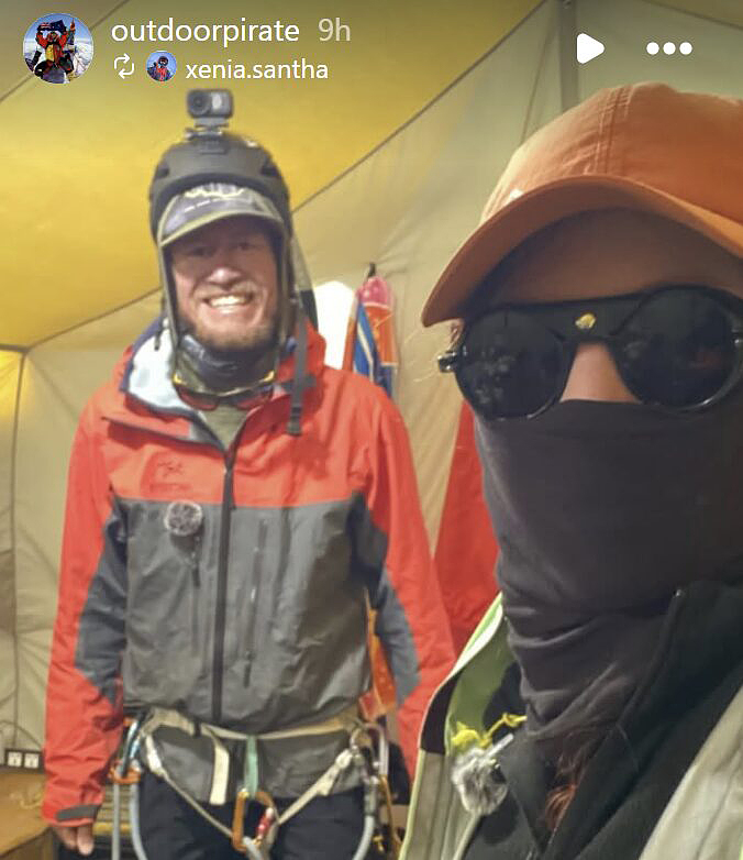 two climbers in tent
