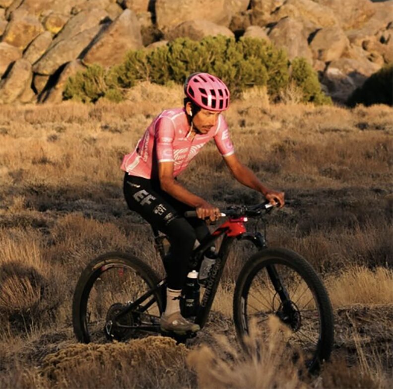 cyclist in desert landscape