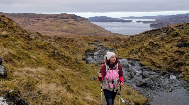 Julia Clarke hiking along a riverbed in Mull, Scotland. Photo: Julia Clarke