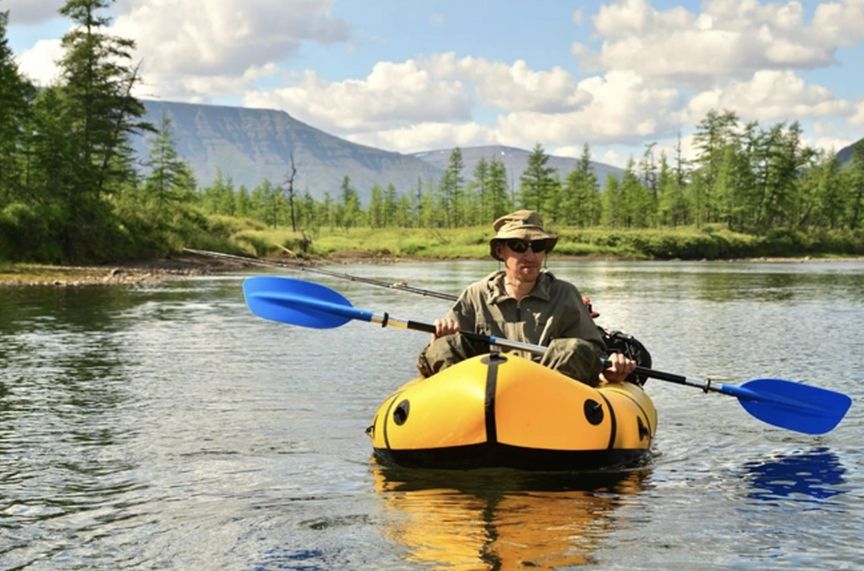 A man in a packraft in Siberia